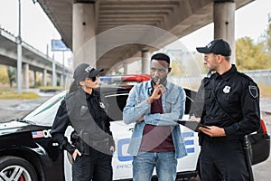 Police officers looking at african american