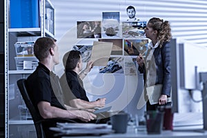 Police officers searching files