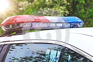 Police patrol car with sirens off during a traffic control. Blue