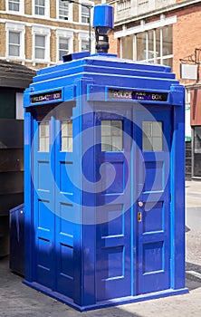 Police public call box outside Earl`s Court tube station in London