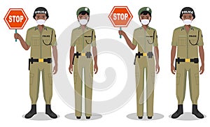Police and quarantine concept. Couple of african policeman and policewoman in traditional uniforms and protective masks standing