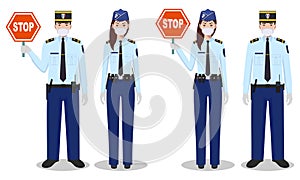 Police and quarantine concept. Couple of french policeman and policewoman in traditional uniforms and protective masks standing