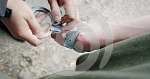 Police remove handcuffs on detainee Top view