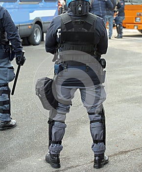 police in riot gear with batons during a protest i photo