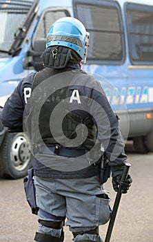 Police in riot gear with blue helmet and truncheon in Itay photo