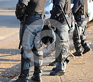 Police in riot gear with protective helmet during the urban revo
