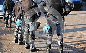 Police in riot gear with protective helmet during the urban revo