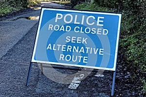 Police Road Closed Seek Alternative Route Sign due to flooding