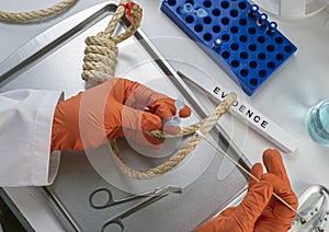 Police scientist extracts DNA sample from hanging victim`s body, crime lab analysis