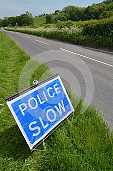 Police slow sign.