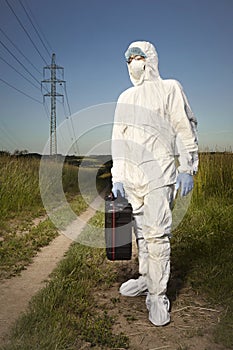 Police technician in DNA free suit and equipment