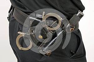 Police utility belt with cuffs and baton photo