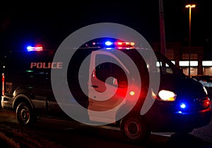 Police van at night with flashing lights