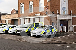 Police vehicles outside the Police station, UK