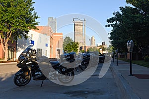 Police vehicles parked in the early morning shade outside of the Bricktown Police Precinct photo