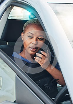 Police woman, car and radio for talking, crime investigation or patrol with thinking in city. African law enforcement