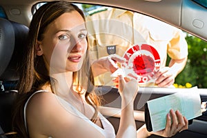 Police - woman in traffic violation getting ticket