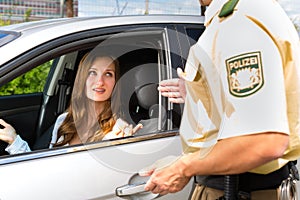 Police - woman in traffic violation getting ticket