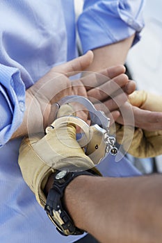 Policeman Arresting Criminal