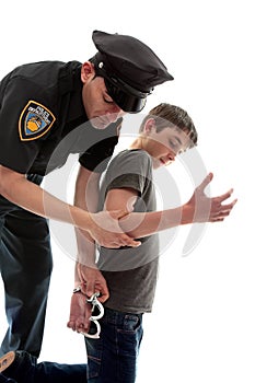 Policeman arresting teen criminal