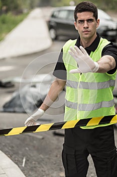 Policeman forbidding entry