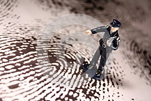 Policeman on giant fingerprint photo