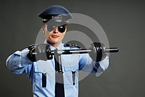 Policeman holds nightstick