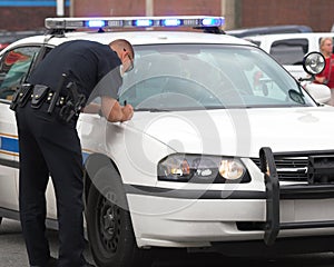 Policeman making report