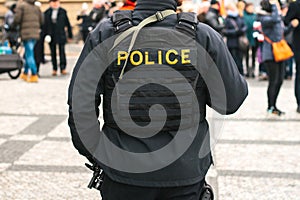 A policeman on the protection of public order. A conceptual image of protecting people by the police. Law enforcement.