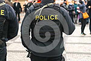 A policeman on the protection of public order. A conceptual image of protecting people by the police. Law enforcement.