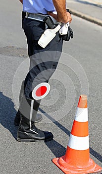 policeman with red paddle traffic