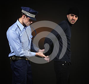 Policeman and thief. Robbery scene.