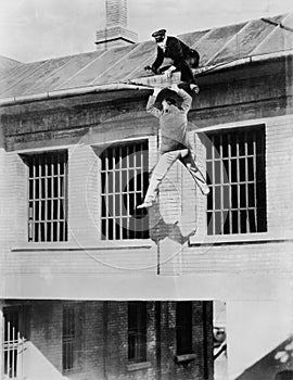 Policeman trying to catch an escaped convict photo