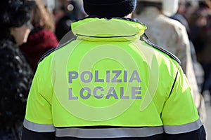 Policeman with uniform and the text POLIZIA LOCALE that means Lo photo