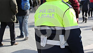 Policeman with uniform and the text POLIZIA LOCALE that meas Loc photo