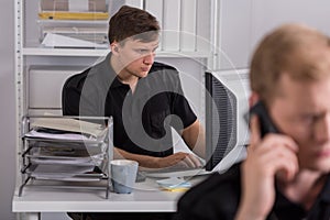 Policeman using computer at work