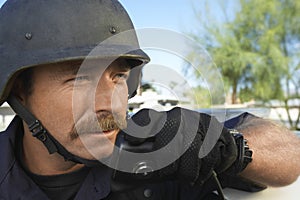 Policeman Using Walkie Talkie Outdoors