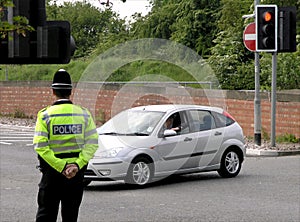 Policeman watching traffic img