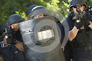 Policemen With Guns And Shield