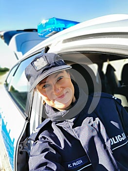 Policewoman in a police car.