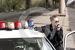 policewoman talking by radio set