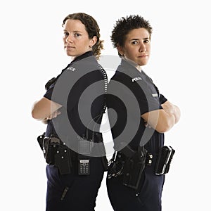Policewomen back to back.
