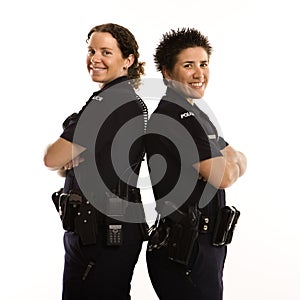 Policewomen back to back.