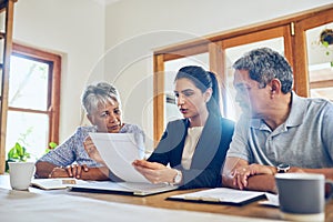 This policy would suit your needs best. Shot of a mature couple getting advice from their financial consultant at home.