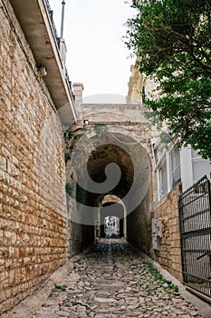 Stone tunnel i old city Polignano mare apulia city street in Italy photo