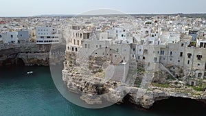 Polignano a Mare Bari, Italy: heaven on earth. Coastal and caves aerial 4k drone footage video above sea