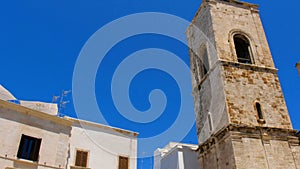 Polignano town old town Matrice church clock bell tower Bari Apulia Italy