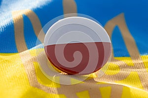 A polish button on the Ukrainian flag