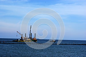 Polish Baltic Sea beautiful blue sea waves sand and beach drilling platform oil rig