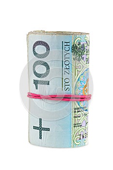 Polish banknotes of 100 PLN rolled with rubber